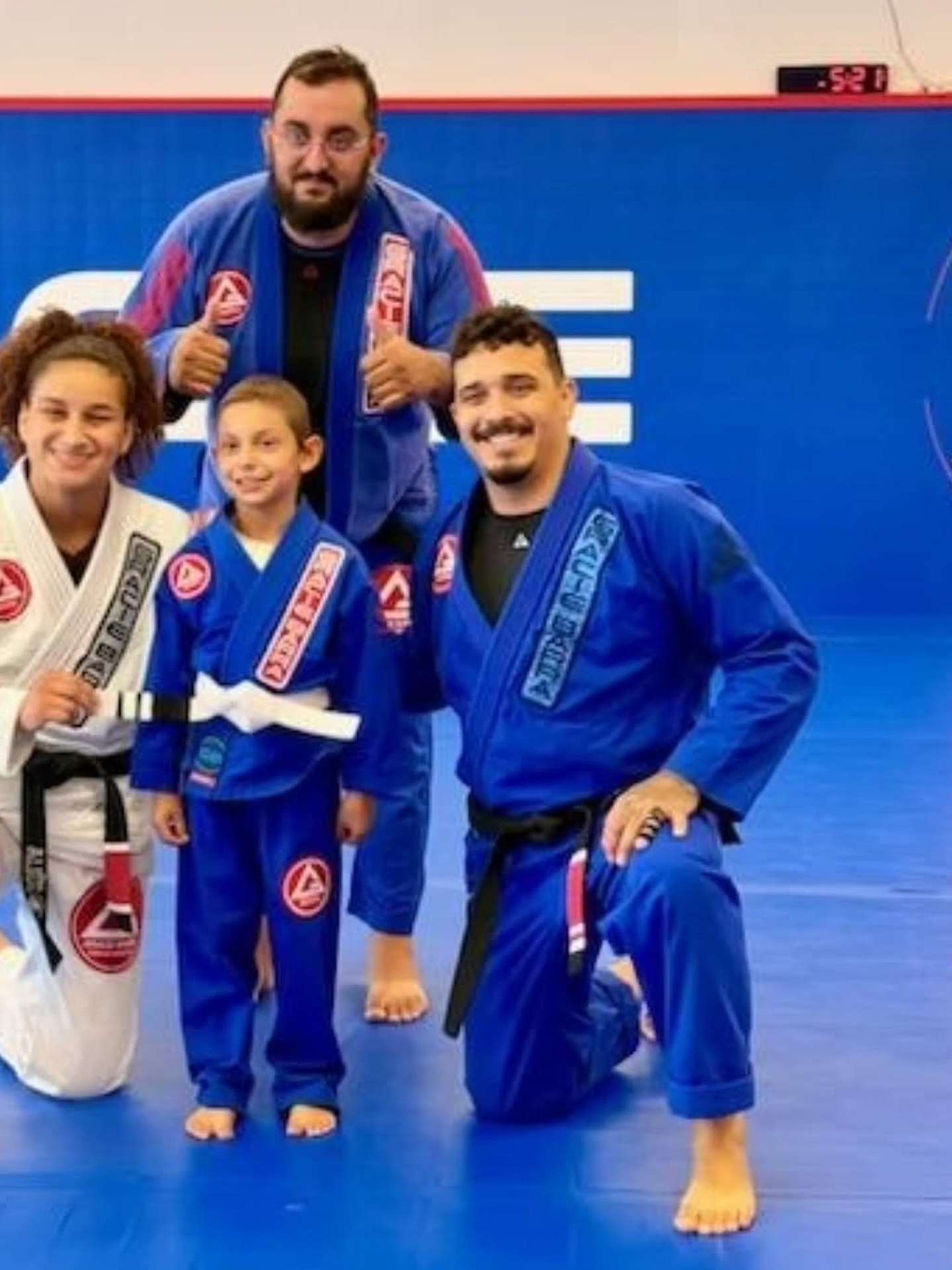 Gracie Barra Lawrenceville instructors coaching on the mat
